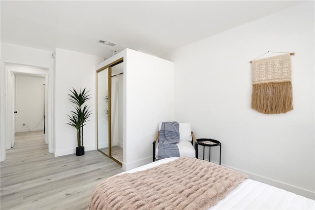 7729 Sedan Ave, West Hills, CA 91304 - bedroom featuring light wood-type flooring and a closet