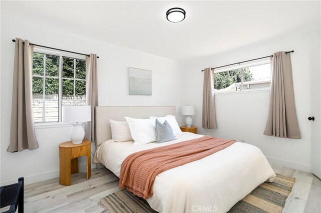 7729 Sedan Ave, West Hills, CA 91304 - bedroom featuring wood finished floors and baseboards