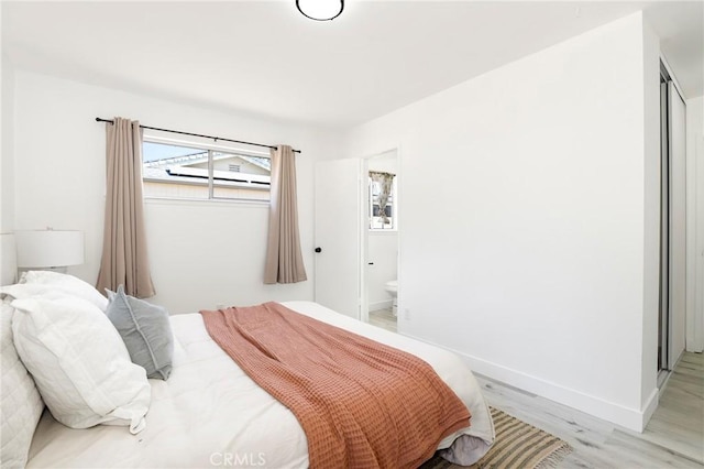 7729 Sedan Ave, West Hills, CA 91304 - bedroom featuring light wood-style floors and ensuite bath