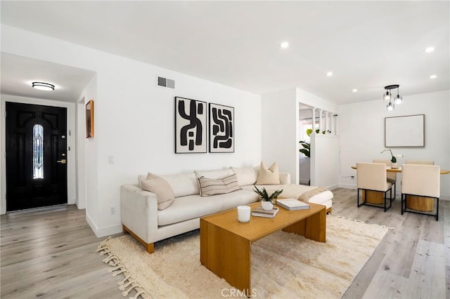 7729 Sedan Ave, West Hills, CA 91304 - living room featuring light wood finished floors and recessed lighting
