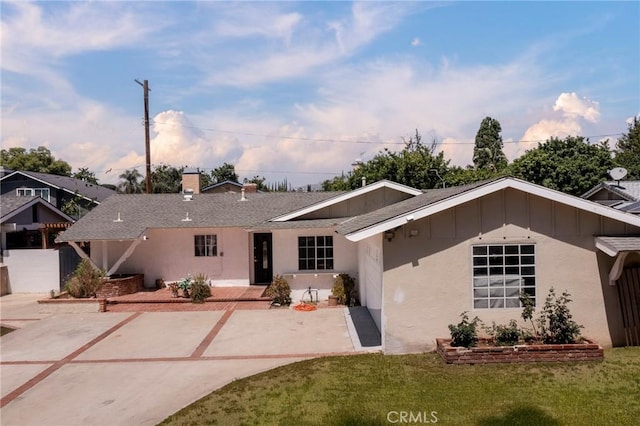 7729 Sedan Ave, West Hills, CA 91304 - view of front facade with a front yard, a patio, a chimney, and board and batten siding
