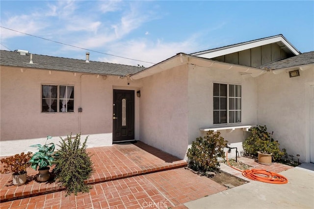 7729 Sedan Ave, West Hills, CA 91304 - view of exterior entry with board and batten siding and roof with shingles