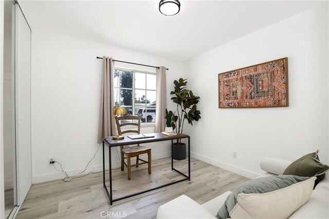 7729 Sedan Ave, West Hills, CA 91304 - home office featuring light wood finished floors and baseboards