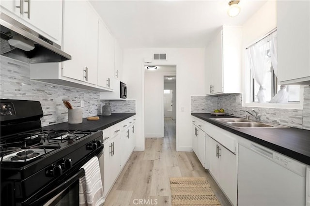 7729 Sedan Ave, West Hills, CA 91304 - kitchen with black range with gas cooktop, dishwasher, ventilation hood, and dark countertops