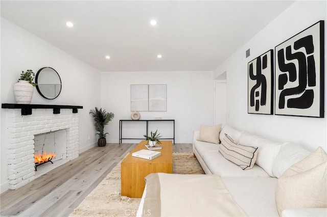 7729 Sedan Ave, West Hills, CA 91304 - living area featuring wood finished floors, recessed lighting, and a fireplace