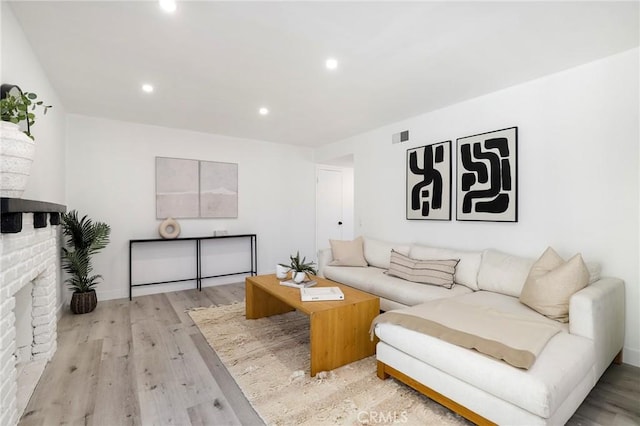 7729 Sedan Ave, West Hills, CA 91304 - living area featuring light wood-type flooring, recessed lighting, and a fireplace