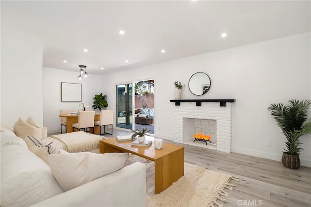 7729 Sedan Ave, West Hills, CA 91304 - living area featuring wood finished floors, recessed lighting, and a fireplace