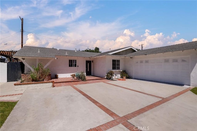 7729 Sedan Ave, West Hills, CA 91304 - ranch-style home with stucco siding, an attached garage, and driveway