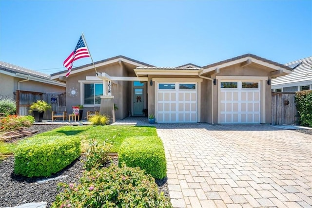 1638 Monterey Ave, Grover Beach, CA 93433 - view of front of home featuring stucco siding, a garage, and decorative driveway