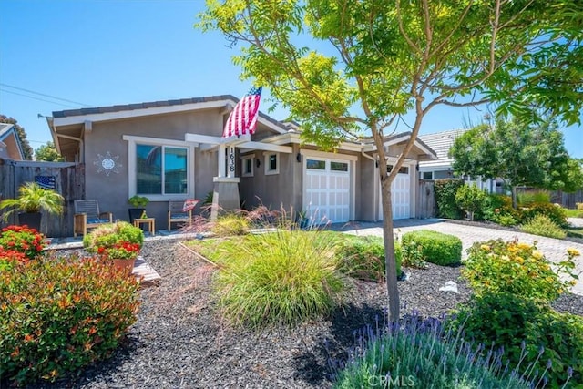 1638 Monterey Ave, Grover Beach, CA 93433 - view of front of house featuring stucco siding, a garage, driveway, and a pergola