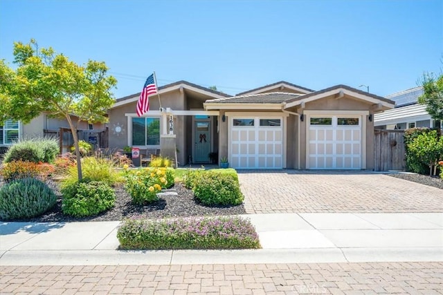 1638 Monterey Ave, Grover Beach, CA 93433 - view of front facade featuring stucco siding, a garage, and driveway