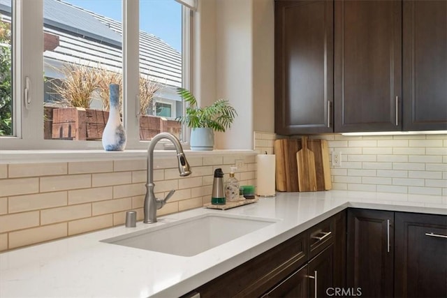 1638 Monterey Ave, Grover Beach, CA 93433 - kitchen with healthy amount of natural light, dark brown cabinets, and backsplash