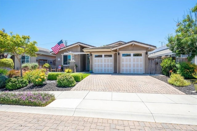 1638 Monterey Ave, Grover Beach, CA 93433 - ranch-style home featuring decorative driveway, stucco siding, and an attached garage