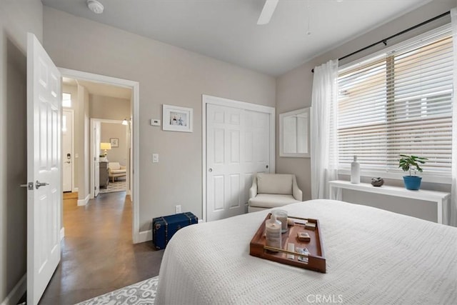 1638 Monterey Ave, Grover Beach, CA 93433 - bedroom with concrete floors, a closet, and a ceiling fan