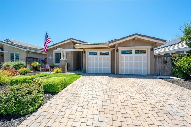 1638 Monterey Ave, Grover Beach, CA 93433 - ranch-style house with stucco siding, decorative driveway, and a garage