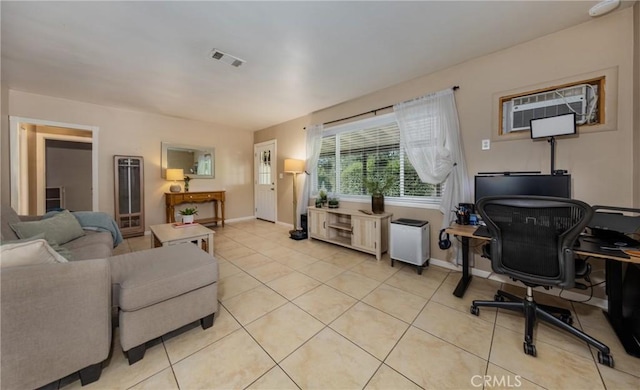 35147 Date Ave, Yucaipa, CA 92399 - living area featuring light tile patterned floors, a wall unit AC, and a desk