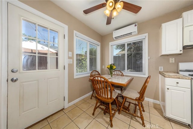 35147 Date Ave, Yucaipa, CA 92399 - dining area featuring an AC wall unit, light tile patterned flooring, and a ceiling fan