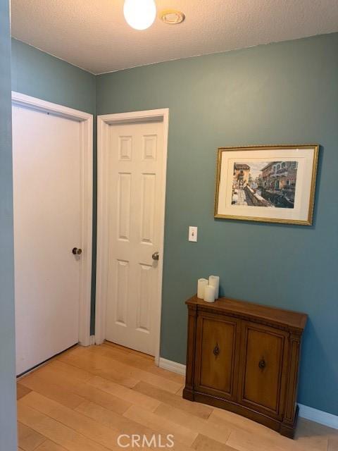 1640 Valencia Ave, Placentia, CA 92870 - corridor with light wood-style floors and baseboards