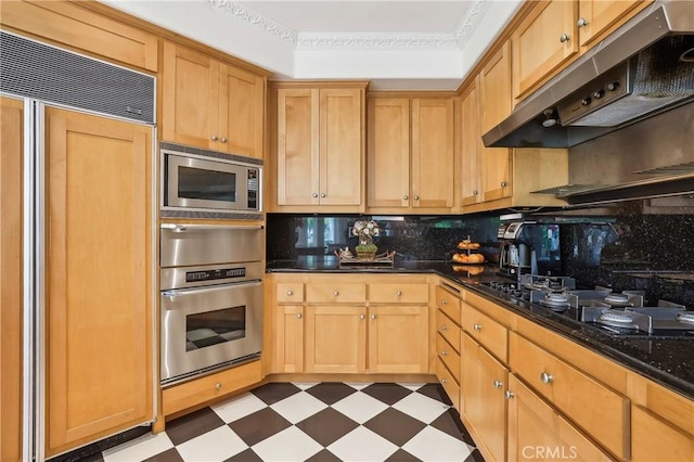 26942 Willow Tree Ln, Laguna Hills, CA 92653 - kitchen with built in appliances, under cabinet range hood, tasteful backsplash, dark flooring, and a warming drawer