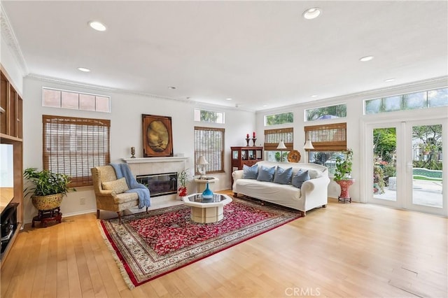 26942 Willow Tree Ln, Laguna Hills, CA 92653 - living area featuring hardwood / wood-style floors, a premium fireplace, recessed lighting, and crown molding
