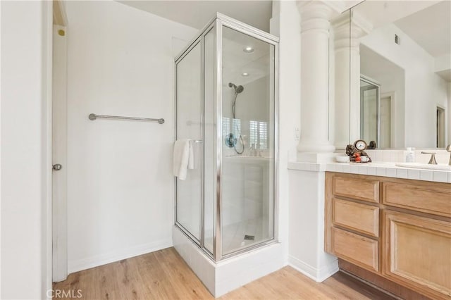 26942 Willow Tree Ln, Laguna Hills, CA 92653 - full bath featuring ornate columns, a shower stall, and vanity