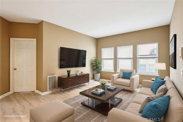 26942 Willow Tree Ln, Laguna Hills, CA 92653 - living room featuring light wood-style floors and baseboards