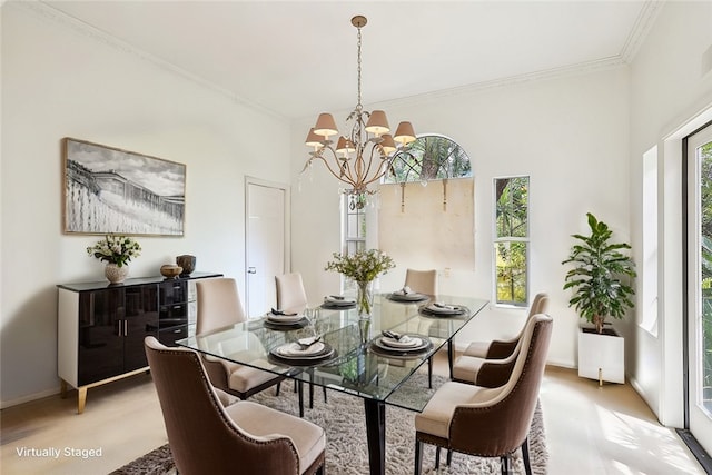 26942 Willow Tree Ln, Laguna Hills, CA 92653 - dining room with crown molding, a chandelier, and light wood-style floors