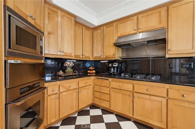 26942 Willow Tree Ln, Laguna Hills, CA 92653 - kitchen with stainless steel microwave, under cabinet range hood, black gas stovetop, and decorative backsplash