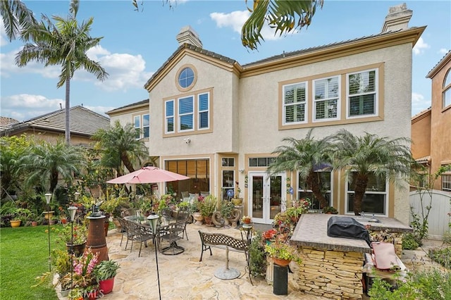 26942 Willow Tree Ln, Laguna Hills, CA 92653 - rear view of property featuring a chimney, a patio area, french doors, and stucco siding