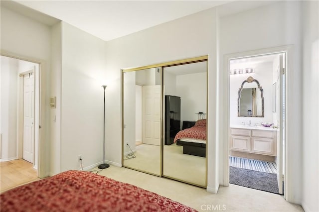 26942 Willow Tree Ln, Laguna Hills, CA 92653 - bedroom with a closet, connected bathroom, and light carpet