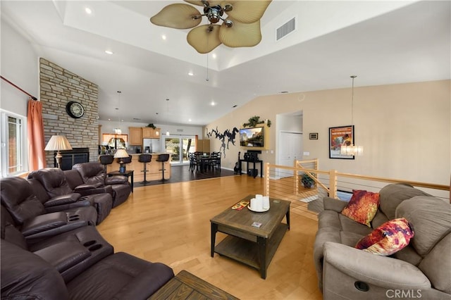 4766 Egret Ln, Paso Robles, CA 93446 - living area with a ceiling fan, recessed lighting, light wood-type flooring, a brick fireplace, and vaulted ceiling