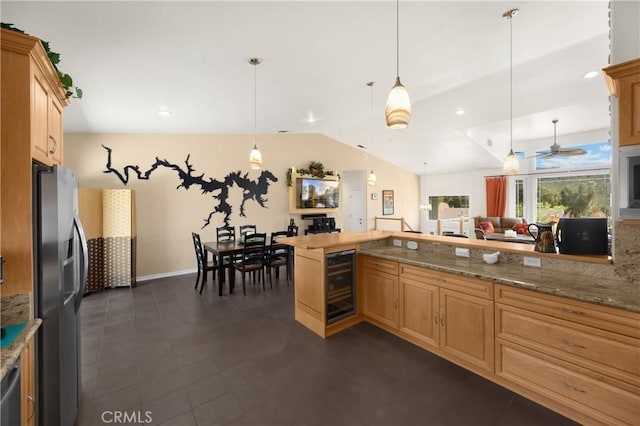4766 Egret Ln, Paso Robles, CA 93446 - kitchen with beverage cooler, stainless steel fridge, lofted ceiling, pendant lighting, and light stone counters