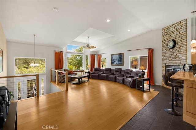 4766 Egret Ln, Paso Robles, CA 93446 - living room featuring a ceiling fan, a stone fireplace, and vaulted ceiling