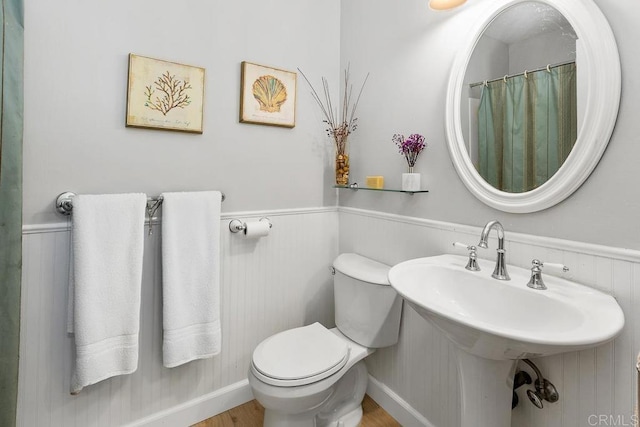 5550 La Cuenta Dr, San Diego, CA 92124 - full bathroom featuring wainscoting and wood finished floors