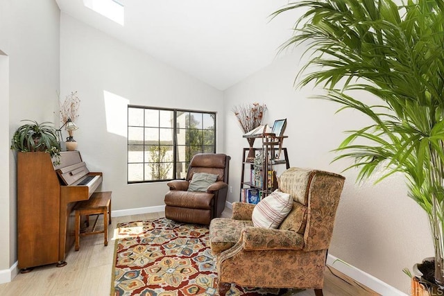 5550 La Cuenta Dr, San Diego, CA 92124 - living area with lofted ceiling, light wood-style flooring, and a skylight