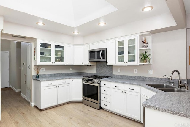 5550 La Cuenta Dr, San Diego, CA 92124 - kitchen featuring appliances with stainless steel finishes, white cabinetry, light wood-type flooring, recessed lighting, and open shelves