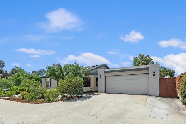 5550 La Cuenta Dr, San Diego, CA 92124 - view of front of property featuring a garage, driveway, and stucco siding