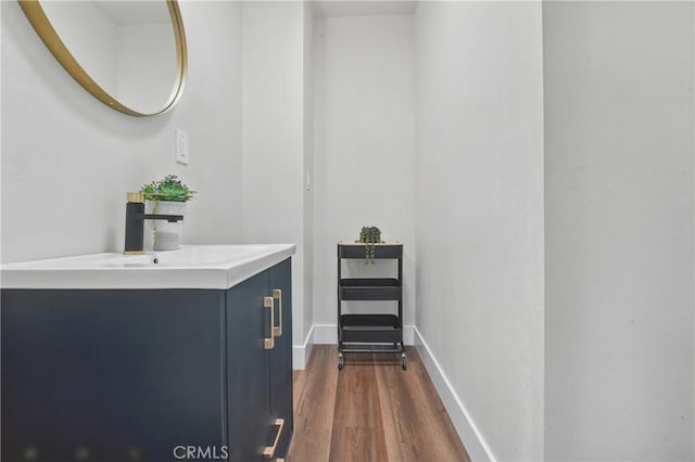 8680 Evergreen Ave, South Gate, CA 90280 - bathroom with wood finished floors and vanity