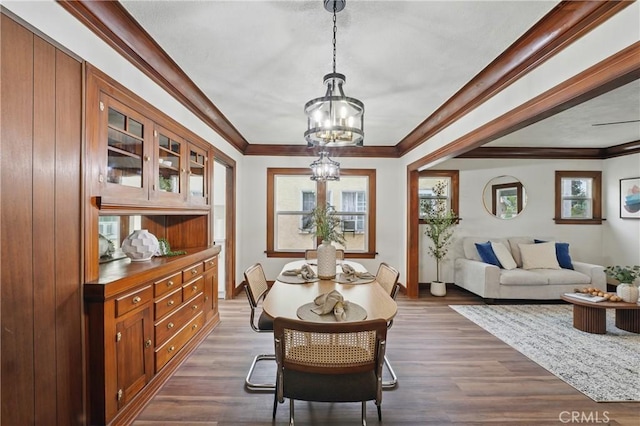 8680 Evergreen Ave, South Gate, CA 90280 - dining area featuring a chandelier, dark wood-style floors, and ornamental molding