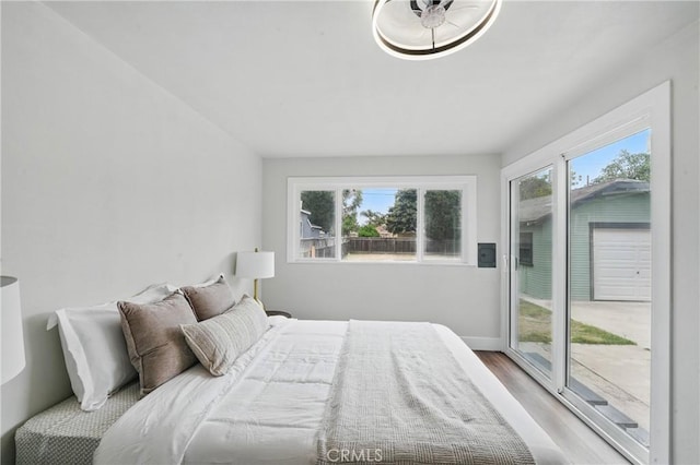 8680 Evergreen Ave, South Gate, CA 90280 - bedroom featuring access to outside and light wood-style floors
