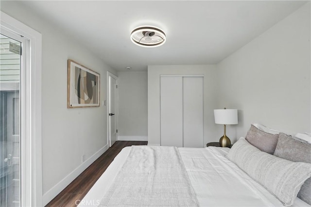 8680 Evergreen Ave, South Gate, CA 90280 - bedroom with dark wood-style floors and a closet
