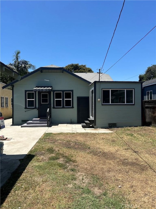8680 Evergreen Ave, South Gate, CA 90280 - view of front facade with a front yard, entry steps, and a patio
