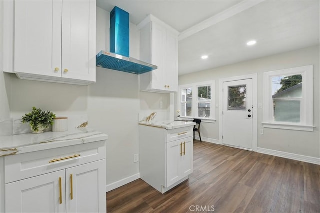 8680 Evergreen Ave, South Gate, CA 90280 - kitchen featuring wall chimney exhaust hood, dark wood-style flooring, white cabinets, plenty of natural light, and recessed lighting