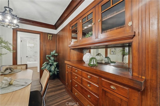 8680 Evergreen Ave, South Gate, CA 90280 - dining area with a chandelier, crown molding, and dark wood finished floors