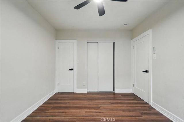 8680 Evergreen Ave, South Gate, CA 90280 - unfurnished bedroom with wood finished floors, a closet, and a ceiling fan