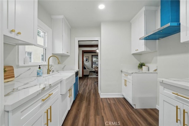 8680 Evergreen Ave, South Gate, CA 90280 - kitchen with wall chimney exhaust hood, dishwasher, dark wood-style floors, and light stone countertops