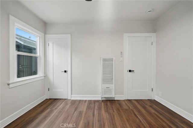 8680 Evergreen Ave, South Gate, CA 90280 - spare room featuring a heating unit, wood finished floors, and a smoke detector