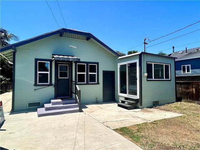 8680 Evergreen Ave, South Gate, CA 90280 - view of front of home with entry steps and a patio