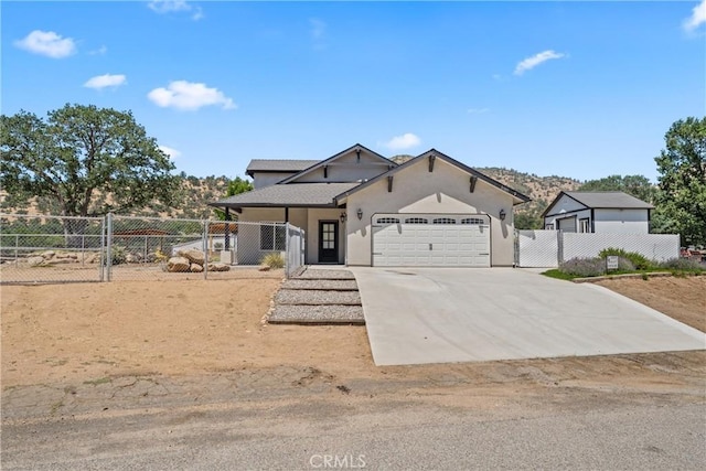 21813 Valley Vista Dr, Tehachapi, CA 93561 - view of front facade with an attached garage, driveway, and stucco siding