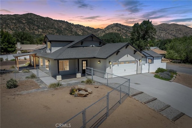 21813 Valley Vista Dr, Tehachapi, CA 93561 - modern farmhouse style home featuring a gate, stucco siding, concrete driveway, and a mountain view